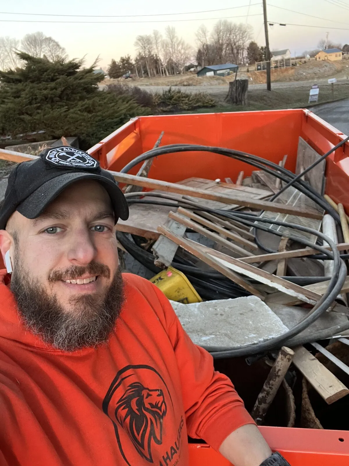 Kingdom Haulers owner with a trailer loaded with demolition debris